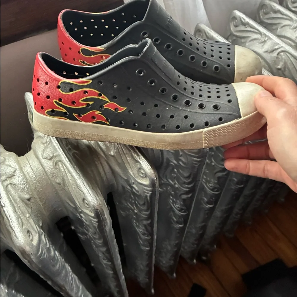Native Shoes Black Slip-On Sneakers with Red and Yellow Flame Accent